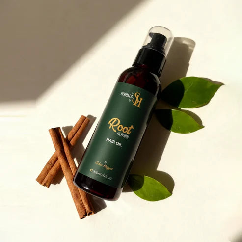 Herbals by SH 300ml herbal hair oil bottle in a bright flat lay.