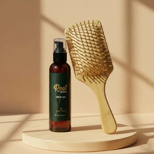 Herbals by SH premium hair oil bottle and wooden comb on a display stand.